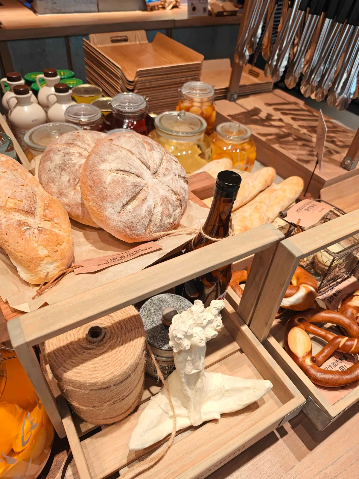 Sourdough rounds and baguettes on a Shenzhen bakery counter